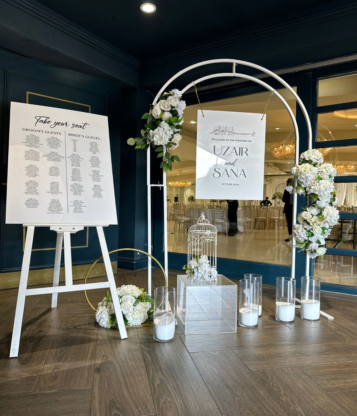 White Arch with Welcome Sign and Seating Plan
